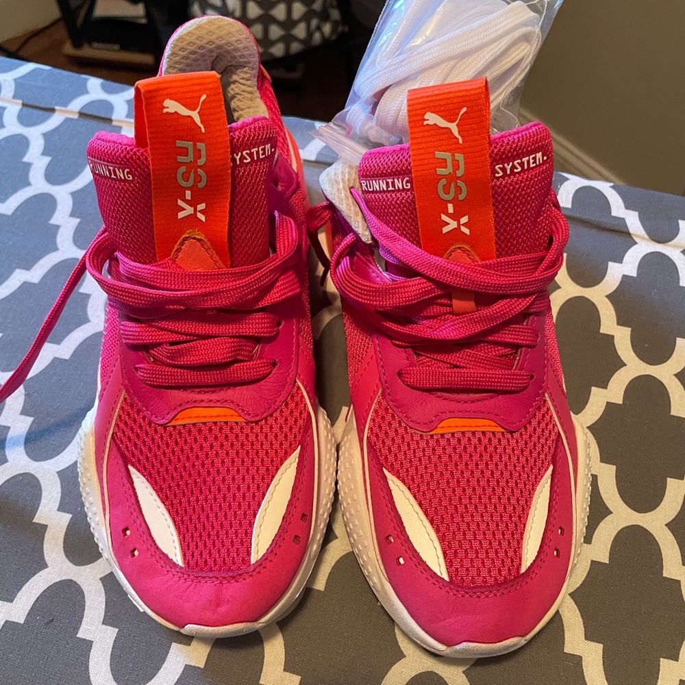 Brand new PUMA size 6.5 in women orange ,pink and white never worn 100.00